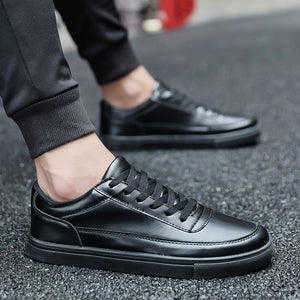 All-black ActiveCore lace-up sneakers worn with black pants
