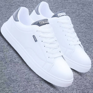 White ActiveCore sport sneakers with gray heel accents on gray fabric