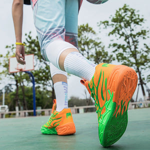 A person outdoors on a basketball court wearing bright neon green and orange athletic sneakers, with the shoes shown in two views: one full-body shot holding a basketball and one close-up of the feet.