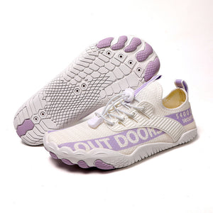 White sneakers with purple accents on a white background