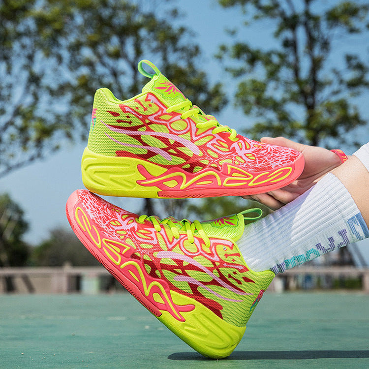 A pair of bright neon yellow and pink basketball shoes with red graphic patterns, shown worn on a court in a top image and held by a hand outdoors in a bottom image.