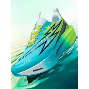 Blue and green sneaker with white sole on a gradient background