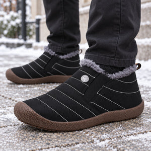 ArcticTrail black fleece-lined snow boots worn on a winter city walk