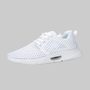 White sneaker with mesh design on a white background