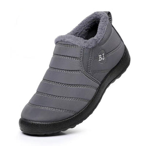 Gray winter slip-on shoe with black sole on a white background