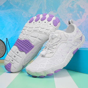 White and purple athletic shoes with a colorful abstract background