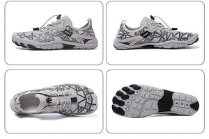White athletic shoes with black sole design on a reflective surface with an orange and gray background.