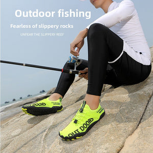 A man sitting on a rock by the water wearing a white long-sleeve top, black leggings, and bright neon yellow water shoes, holding a fishing rod. Large Chinese and English text appears on the left side of the image.