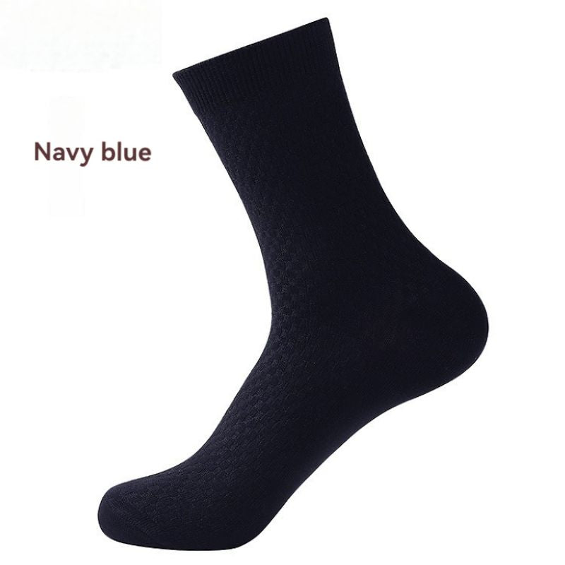 Elorvian bamboo sock in navy blue, mid-calf crew, on foot form
