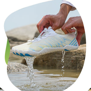 A white athletic shoe with blue and yellow accents is shown being held over shallow water, with water dripping from the sole. Above the photo, text reads 'Amphibious quick-drying drainage' with three feature icons: drainage and ventilation, wetland anti-skid, and lightweight and comfortable.