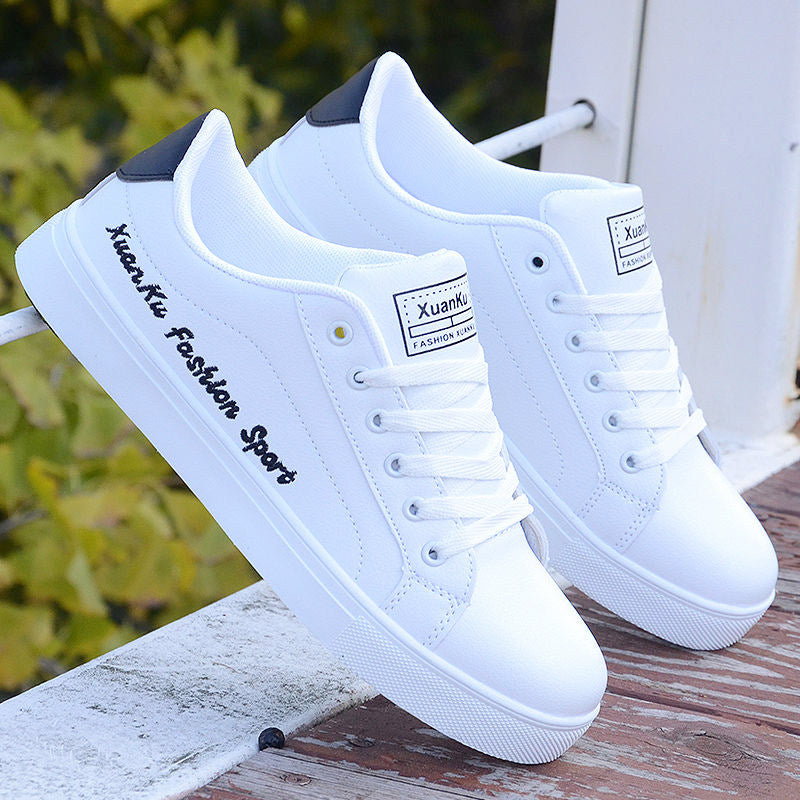 All-white ActiveCore sneakers with black printed side detail displayed outdoors