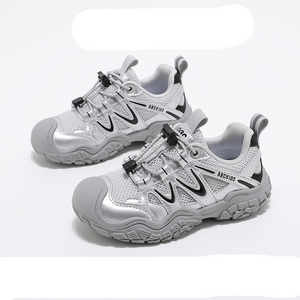 White children's shoes with black accents on a white background, featuring the ABCKIDS brand.
