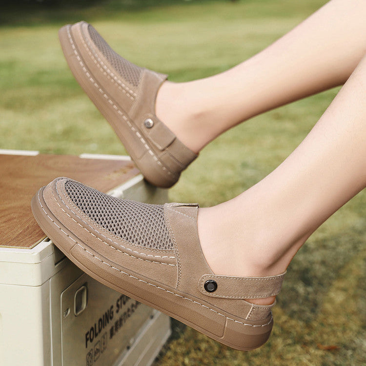 Person wearing brown slip-on shoes with a blurred outdoor background