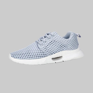 Light blue sneaker with white sole on a white background