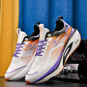 Pair of sports shoes with white, orange, and purple design on a dark surface with colorful curtains in the background.