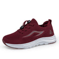 A single low-top athletic sneaker in burgundy mesh with a thick white sole, shown from a side profile on a white background.