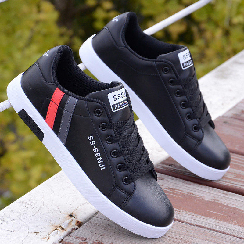 Black ActiveCore sneakers with white soles and red-gray heel accents outdoors