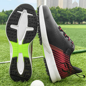 A pair of black and red golf shoes displayed on a green grass field with a golf ball in the foreground and a blurred cityscape background. One shoe is shown from the sole, revealing a black and white tread pattern with a bright green accent, and the other is shown from the side, displaying a black and red knit pattern on the heel.