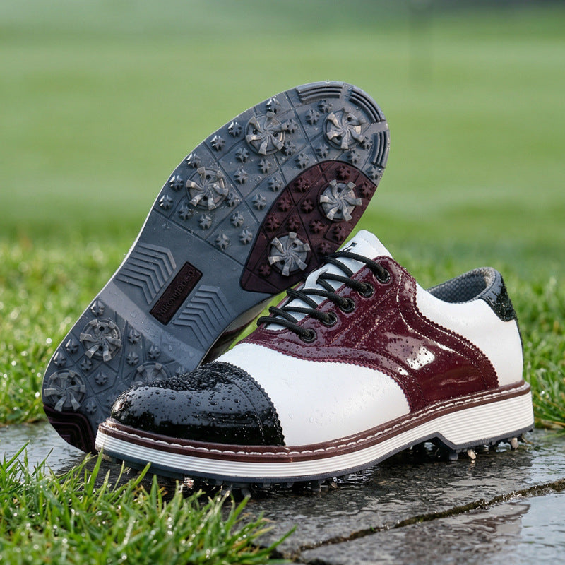 Golf shoes with black and white design on grass