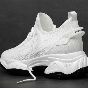 White athletic sneaker shown from multiple angles with product specifications and a size chart below, on a dark background.