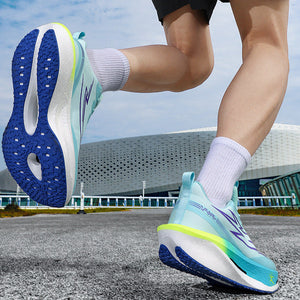 Person wearing blue and green running shoes with a modern building in the background