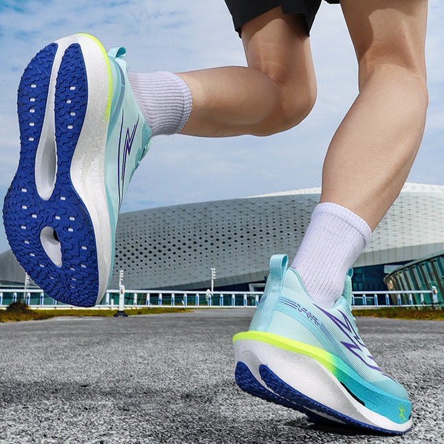 Person wearing blue and green running shoes with a modern building in the background