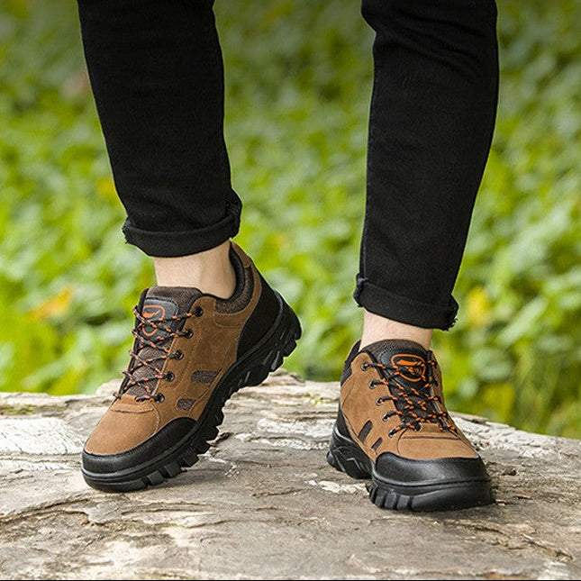 A person wearing brown and black tech anti-slip hiking shoes outdoors on a stone surface with green foliage in the background. White text overlays read 'Tech anti-slip hiking shoes' and 'Outdoors powerhouse'.