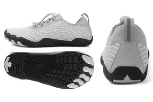 A pair of light gray and white water shoes with black soles, shown in multiple views including a top-down view, side profile, and back view. The shoes feature a textured knit upper, lace-up front, and yellow lining visible inside.