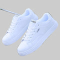 All-white ActiveCore sport sneakers shown as a pair on a light gray background