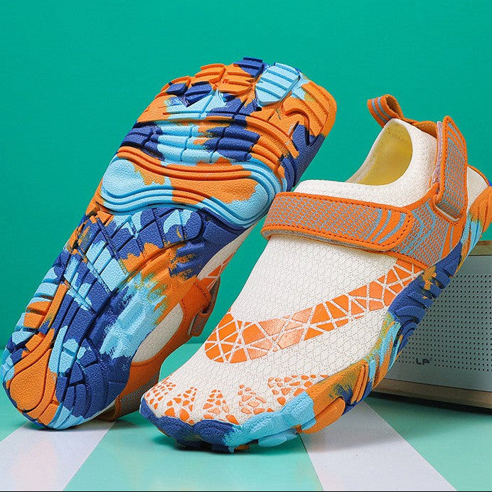 A pair of slip-on sneakers shown on a teal and white background with product information text below. The shoes have a colorful geometric pattern in orange, blue, pink, yellow, and white, with one shoe turned to show the sole.