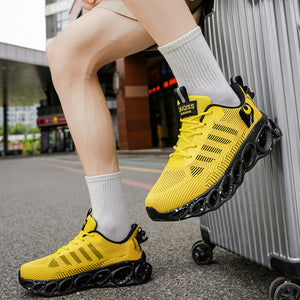 A person sitting on a silver suitcase outdoors wearing bright yellow athletic sneakers with black soles and white socks. The photo includes the text 'RESTORING ANCIENT WAY' at the top.