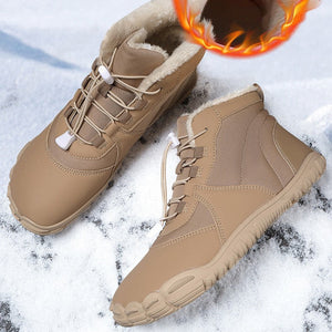 A pair of beige winter lace-up boots with a warm flame graphic showing the lining, set against a snowy background with promotional text.