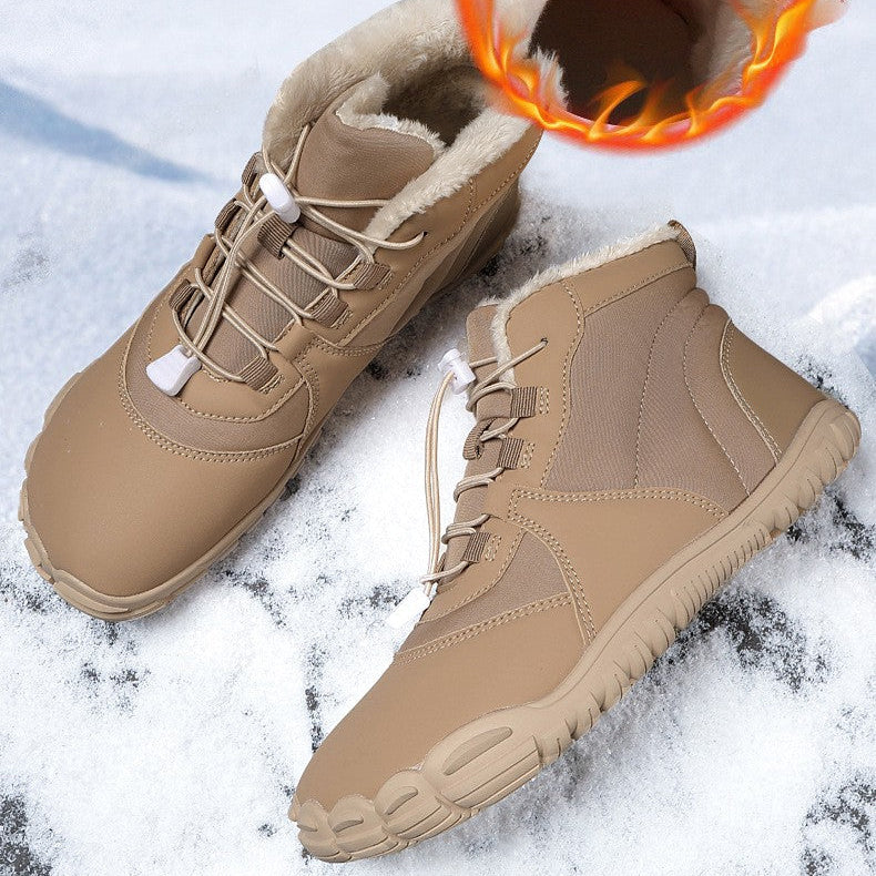 A pair of beige winter lace-up boots with a warm flame graphic showing the lining, set against a snowy background with promotional text.