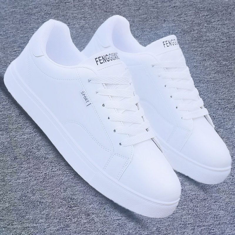 All-white ActiveCore sport sneakers shown as a pair on gray fabric