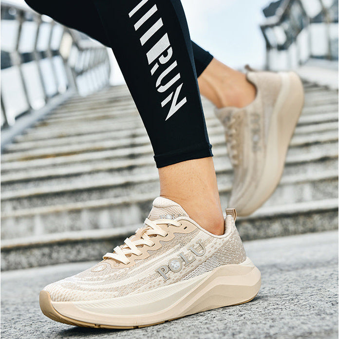 A person wearing beige textured platform sneakers with 'POLU' branding and black leggings with 'RUN' printed in white, walking up outdoor concrete stairs.