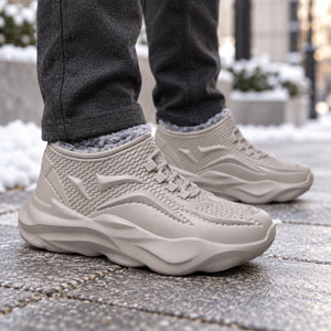 WeatherShield gray plush-lined winter boots worn on a cold city walk